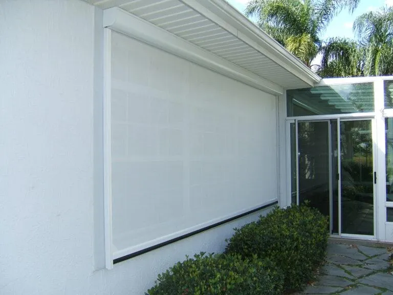 Motorized window shade extended to reduce interior heat and glare