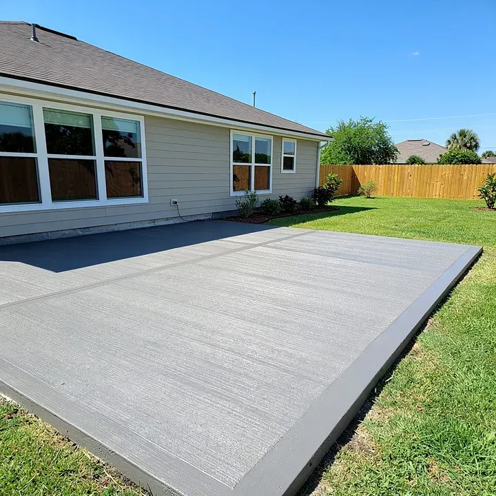 Freshly completed concrete patio installation at a residential property in Marrero Louisiana