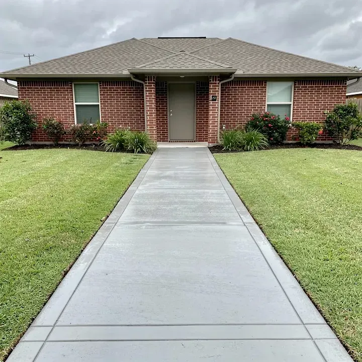 Freshly finished concrete sidewalk at a residential property in Marrero Louisiana