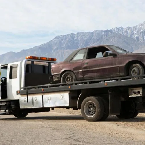 old car being towed by Northdale Towing Service