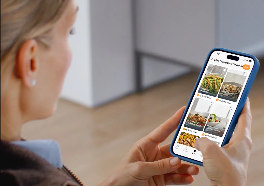 a woman choosing dinners in a grocery app