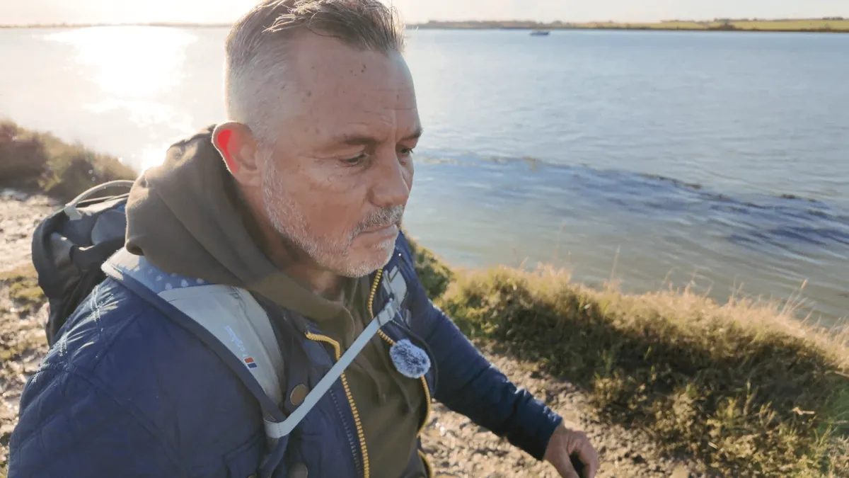 Wayne Phipps walking outdoors while discussing quitting the rat race after 50