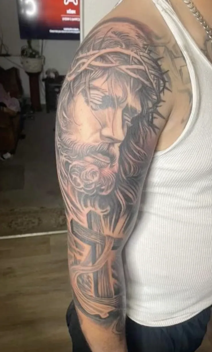 person with tattoo on right arm
