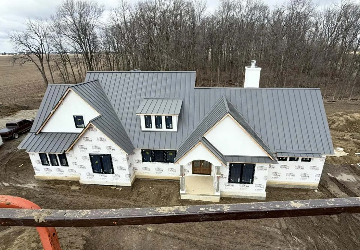 a building with flowers on the windows