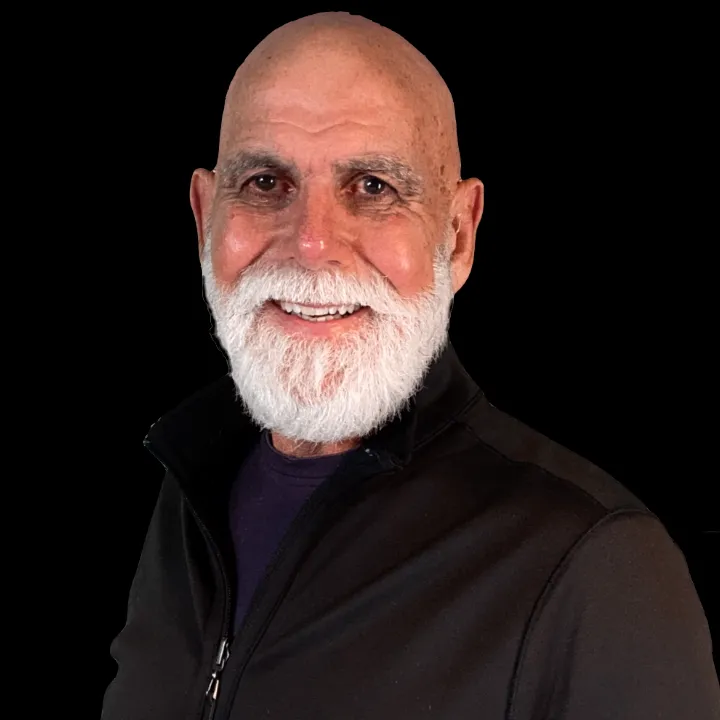 a green train car sitting on top of a hill