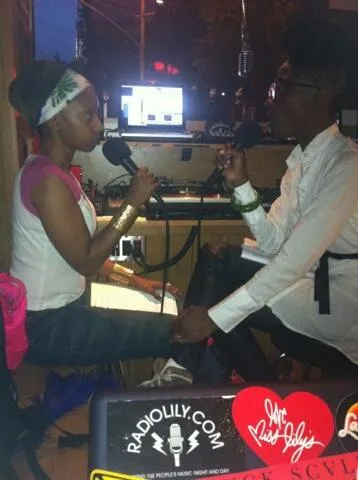 woman in green dress painting