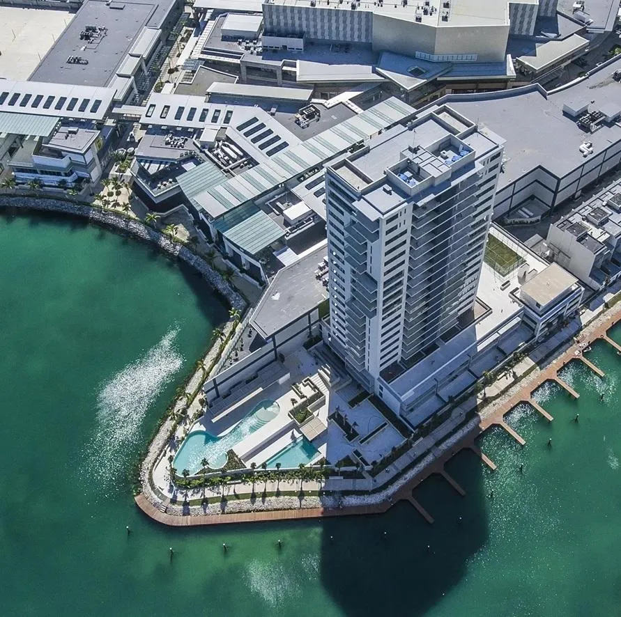 Armani Residences Masaryk luxury outdoor terrace with infinity pool, modern wooden slat architecture, designer furniture and panoramic views - premium residential development