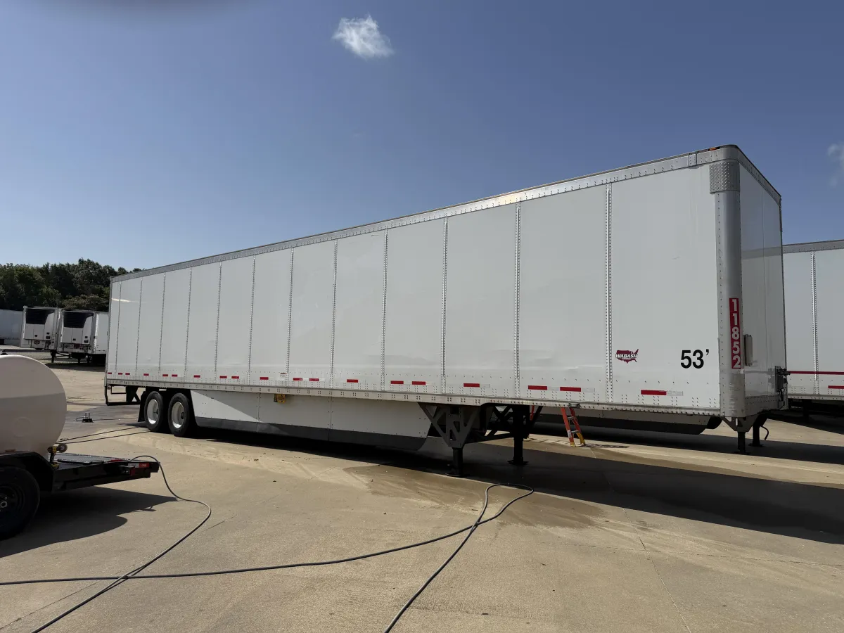 Clean commercial semi-trailer after professional trailer decal removal in Tupelo, with the exterior surface prepared for new branding.