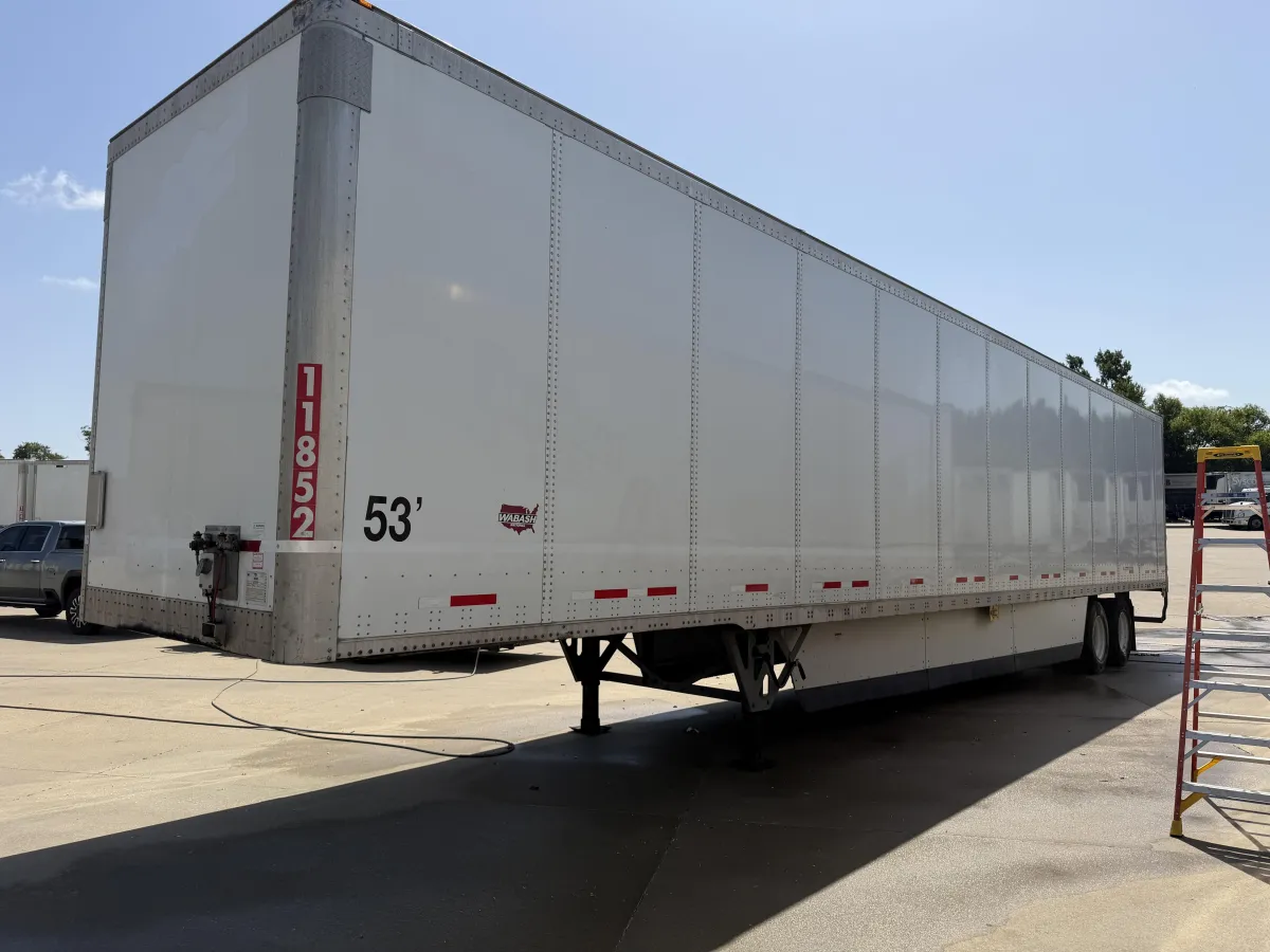 Commercial trailer parked on a freshly cleaned concrete surface showcasing professional concrete cleaning in Corinth.