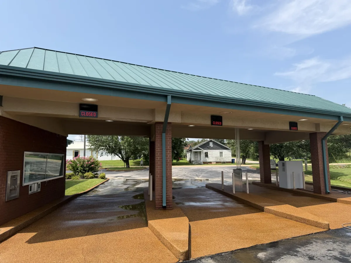 Clean commercial drive-through and exterior surfaces after professional commercial pressure washing in New Albany.