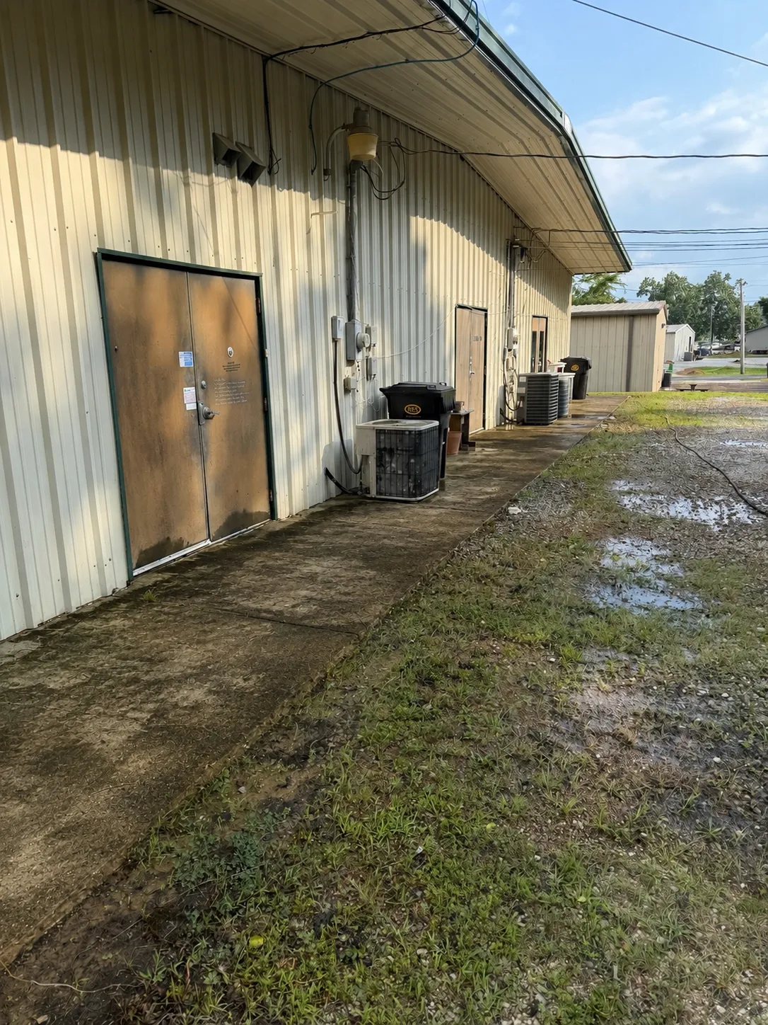 Commercial building exterior before professional cleaning by Massengill Surface Solutions.