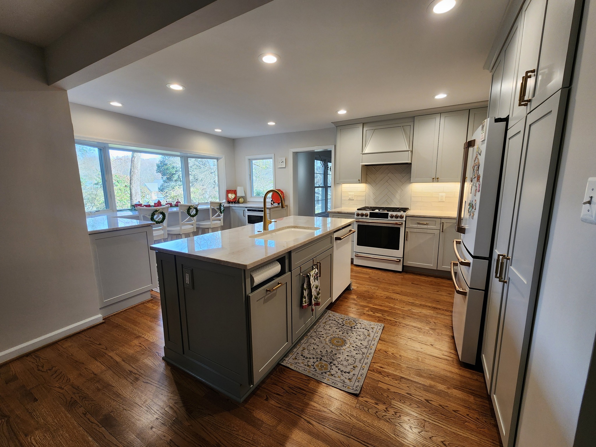 Annandale Virginia kitchen remodel with increased counter space wider walkway for accessibility and raised bay window overlooking backyard
