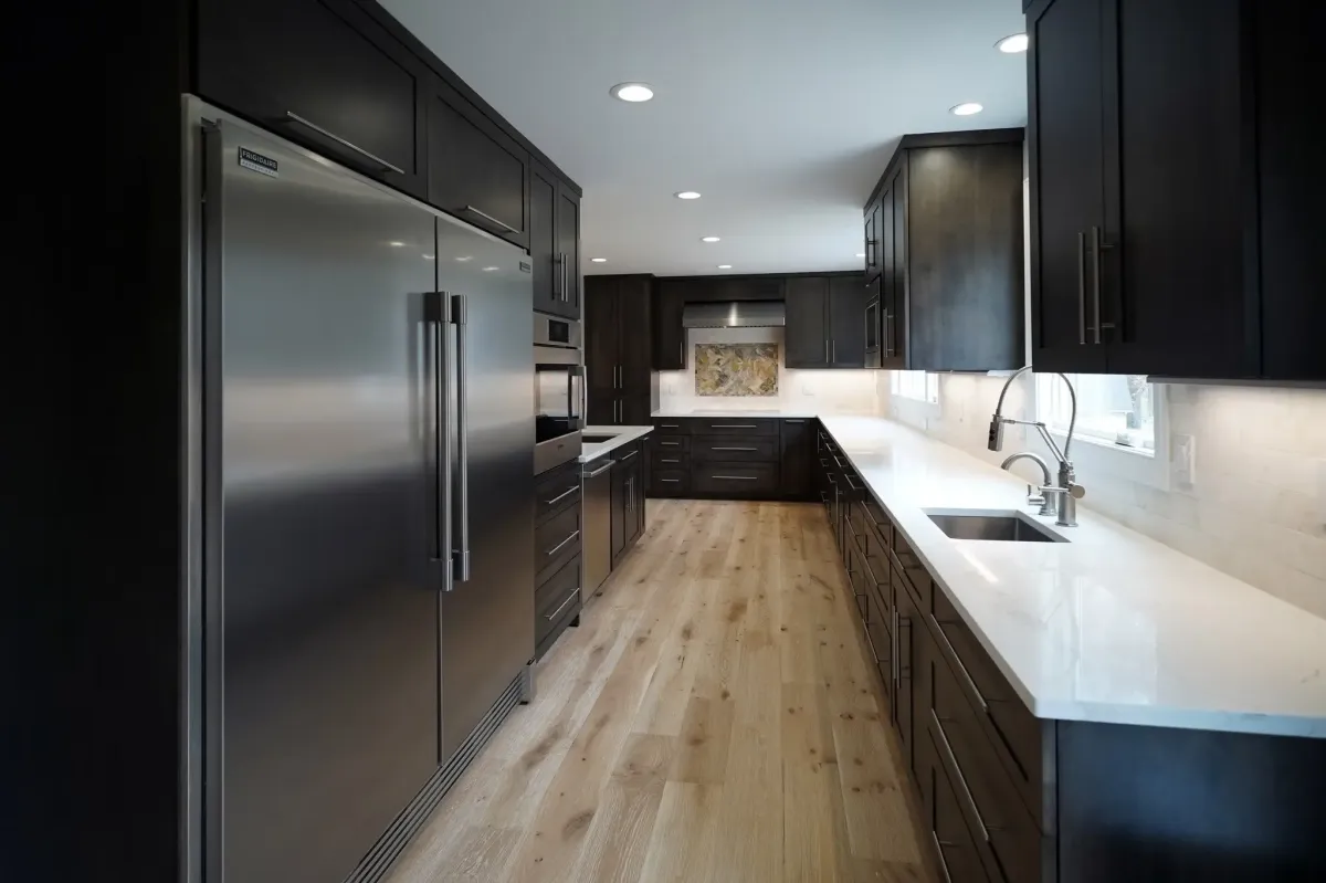 Oakton Virginia full kitchen remodel with new flooring and lighting throughout main level after wall removal