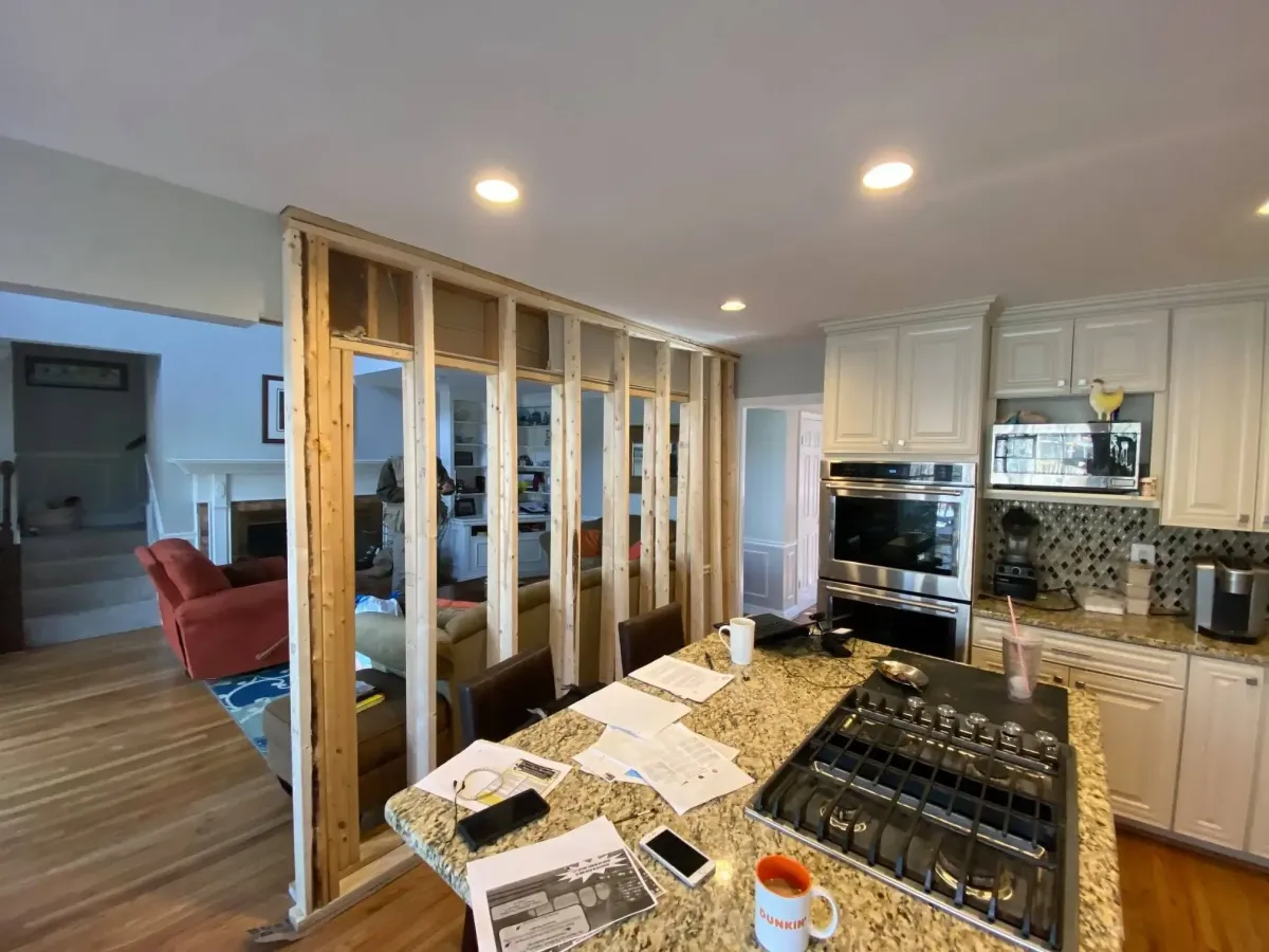 Fairfax Virginia home with cracks forming on two story family room wall from missing load bearing wall removed without permit