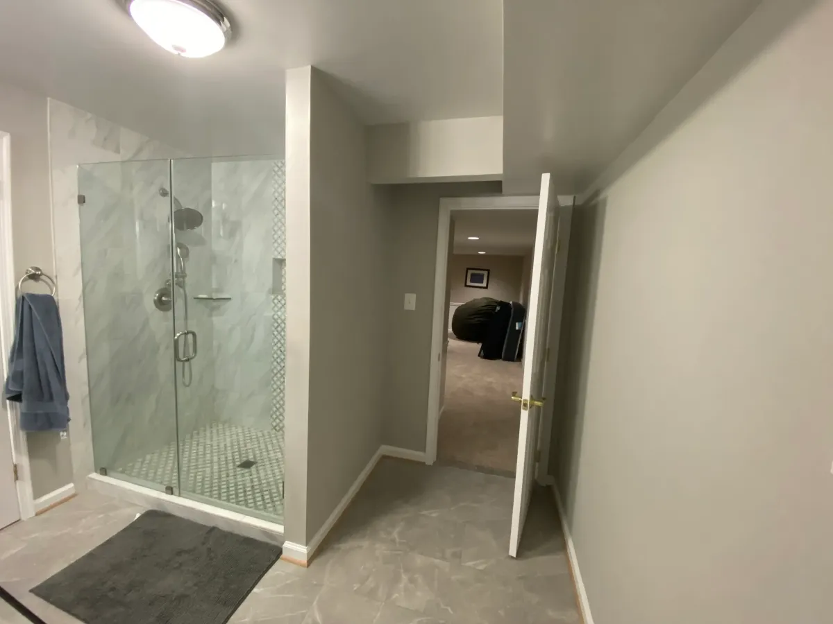 Fairfax Station removed bookcase and created a hallway door. Replaced tile floor with similar tile after footer installation