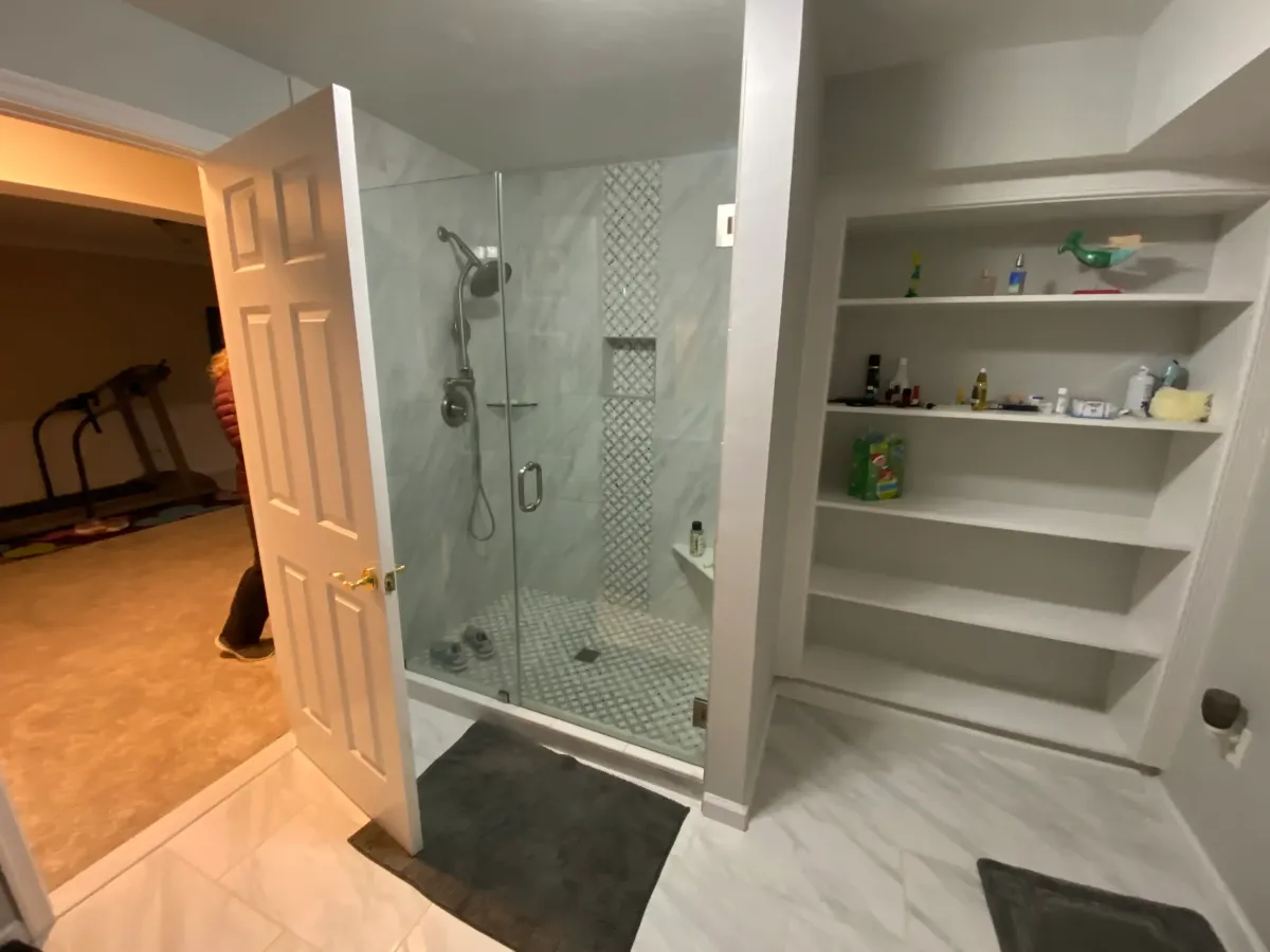 Fairfax Station Basement Bathroom Before Tile Demolition. Old Bookcase.