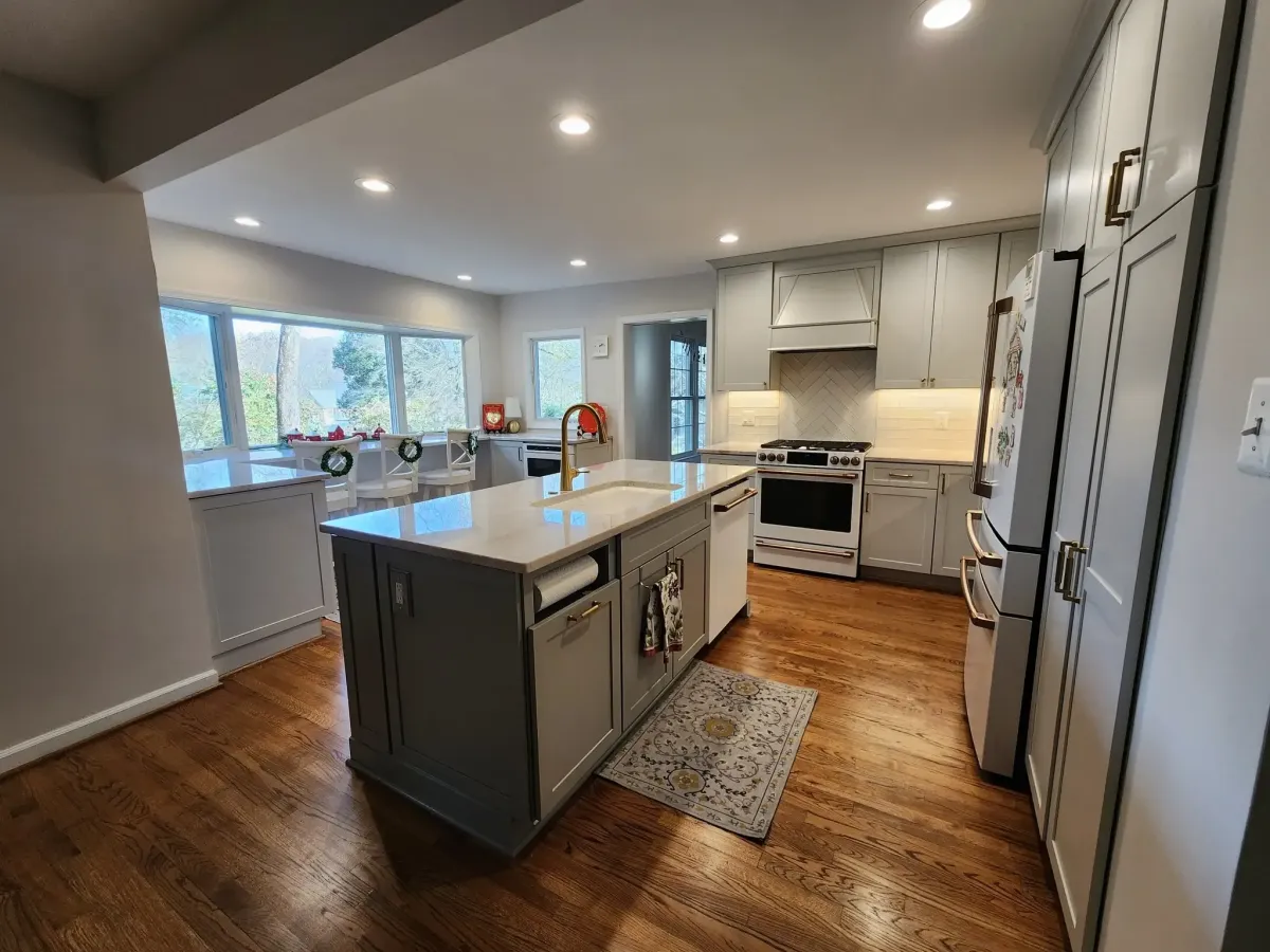 Annandale Virginia kitchen remodel with increased counter space wider walkway for accessibility and raised bay window overlooking backyard
