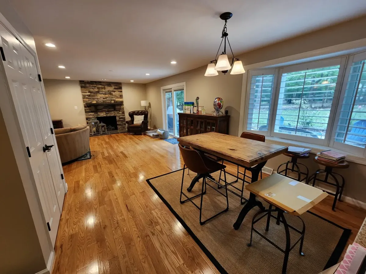 Reston Virginia completed open concept kitchen and family room after partition wall removal with hardwood flooring repaired and refinished