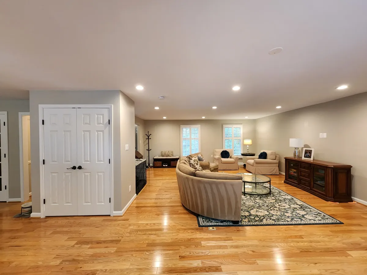 Reston Virginia completed open concept family room and living room with flat flush ceiling after load bearing wall removal