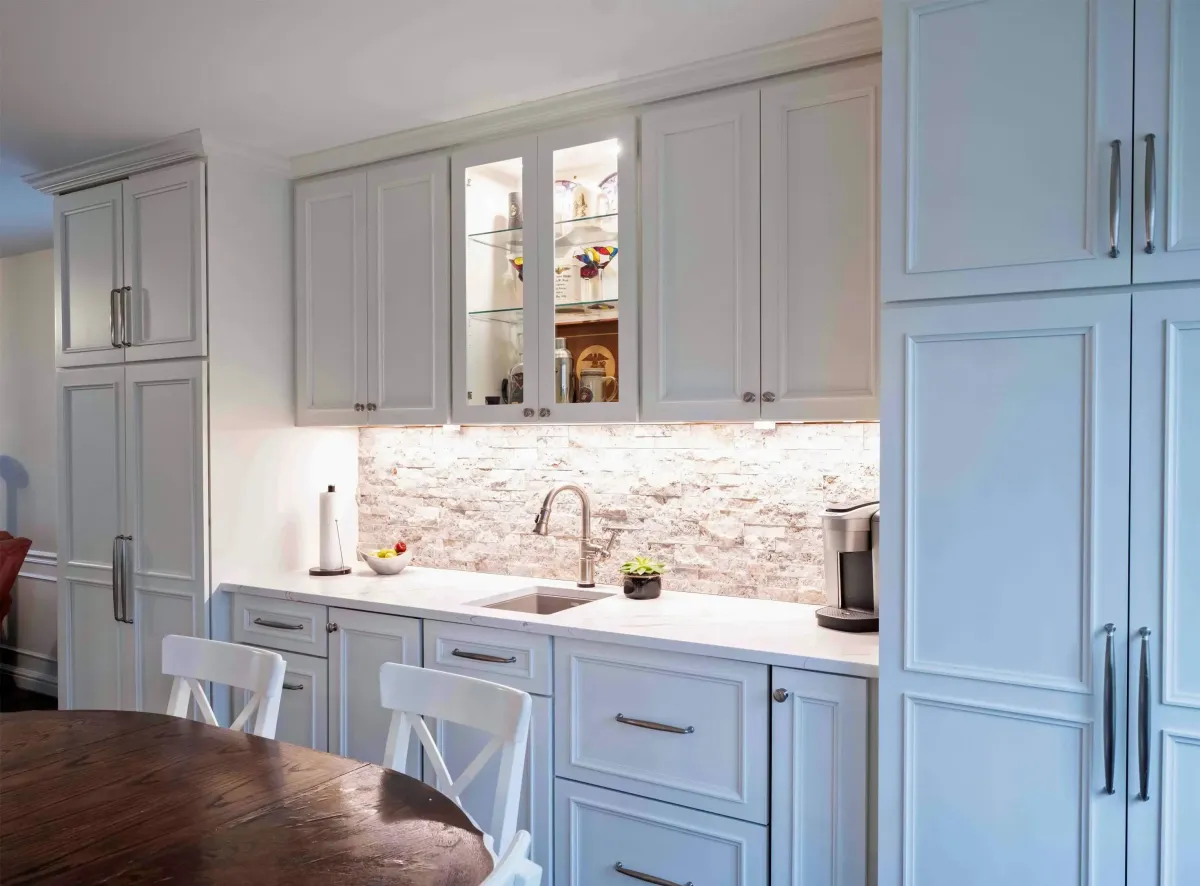 Fairfax Station Virginia completed custom kitchen with built-in coffee bar panel ready refrigerator and freezer wet bar sink and custom island after formal dining room conversion