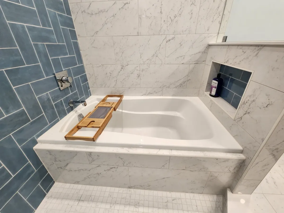 Falls Church Virginia deep soaking tub installed in primary bathroom remodel with Japanese inspired design