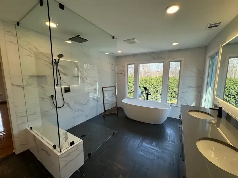 Oakton Virginia bathroom remodel with freestanding tub, walk-in shower, custom vanity, and floor-to-ceiling tile