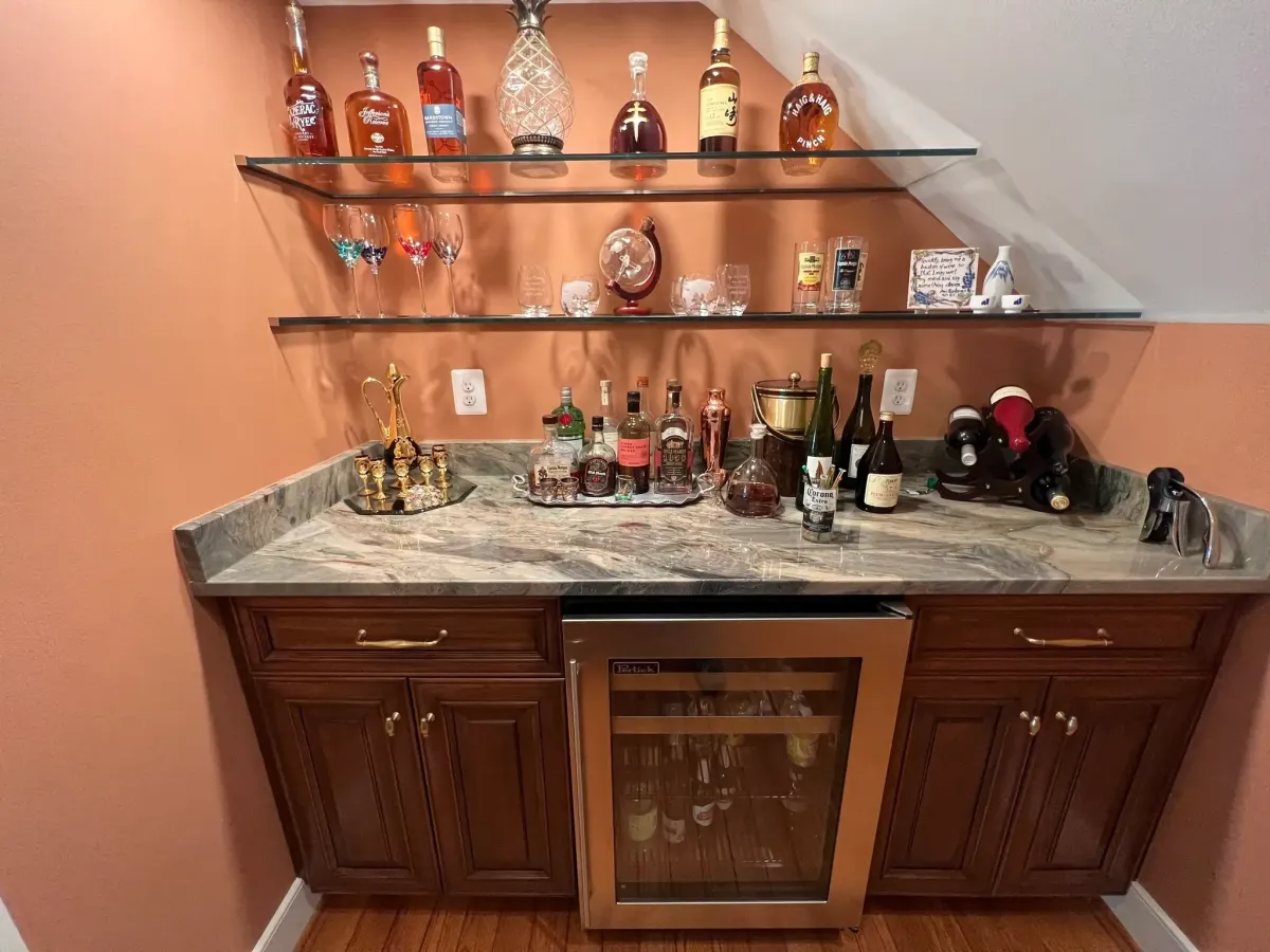 Falls Church Virginia stone tile backsplash with Italian hand painted tile mural centerpiece in custom Tuscany inspired kitchen