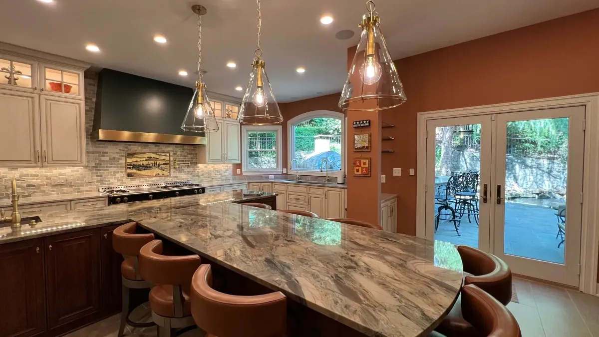 Falls Church Virginia custom Tuscany inspired kitchen with T-shaped layout 10 foot island and 8 foot chef's table by Prevo custom cabinets