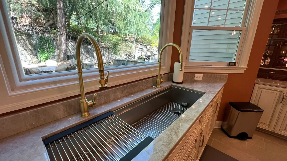 Falls Church Virginia Galley 57 inch sink with dual faucets prep inserts and island prep sink in custom kitchen remodel