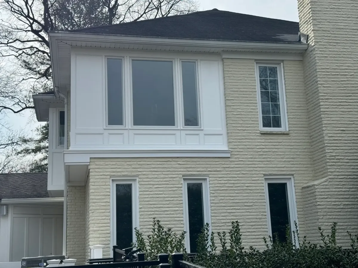 Oakton Virginia completed primary bathroom suite with curbless shower freestanding tub double floating vanity walk-in closet and tall windows after full structural repair and sun porch conversion