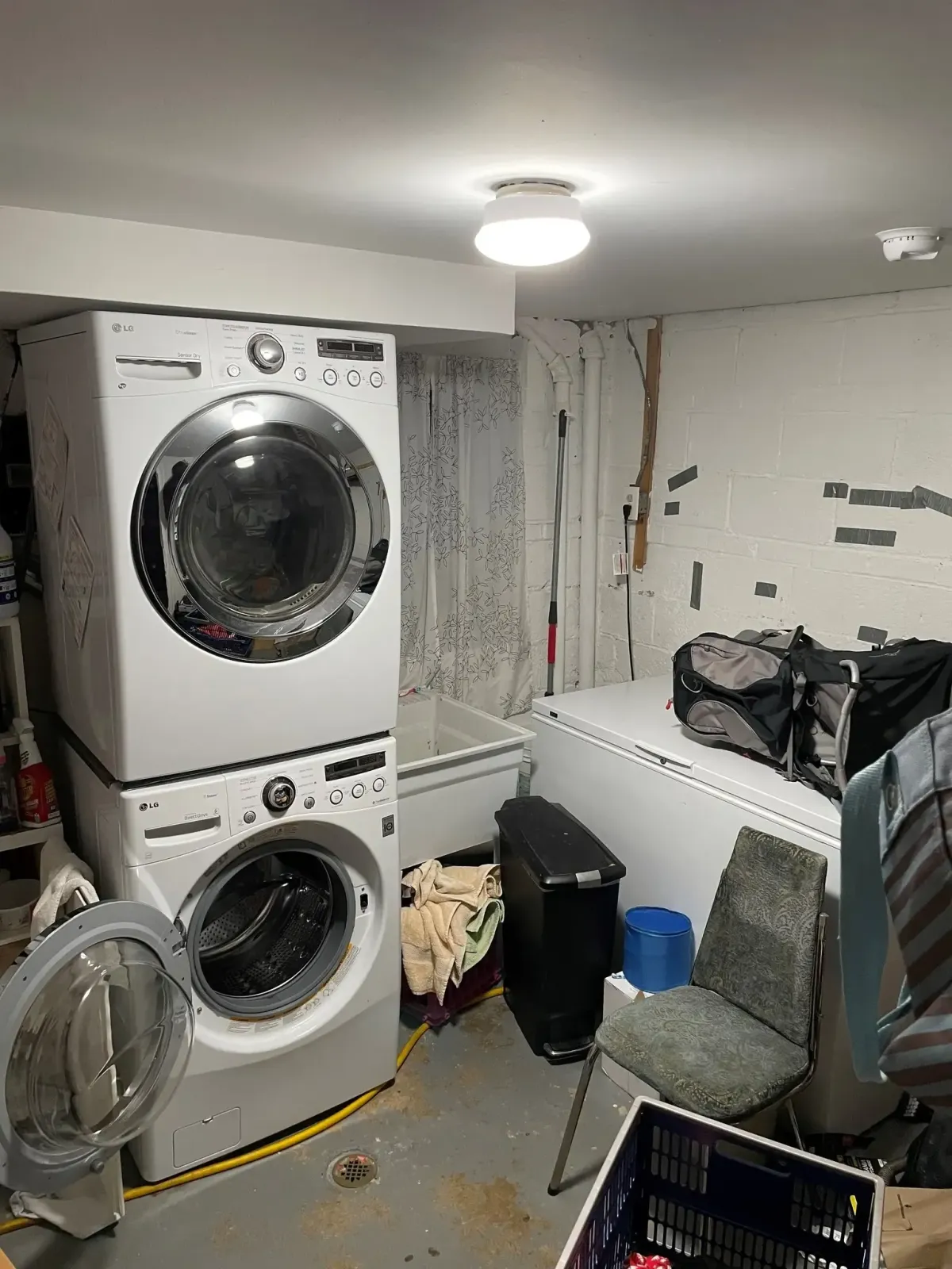 Falls Church Virginia unfinished basement before bathroom and laundry addition with concrete slab cutting required for new drain installation