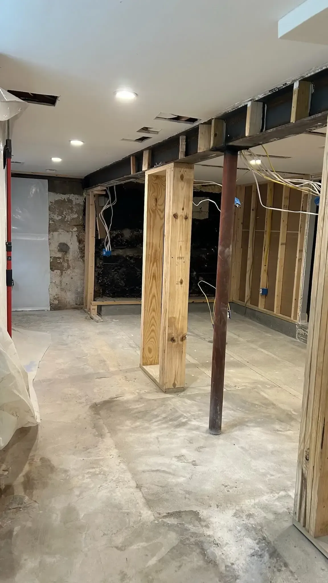 Upper basement pantry framing in progress during Arlington structural remodel by HandyMensch