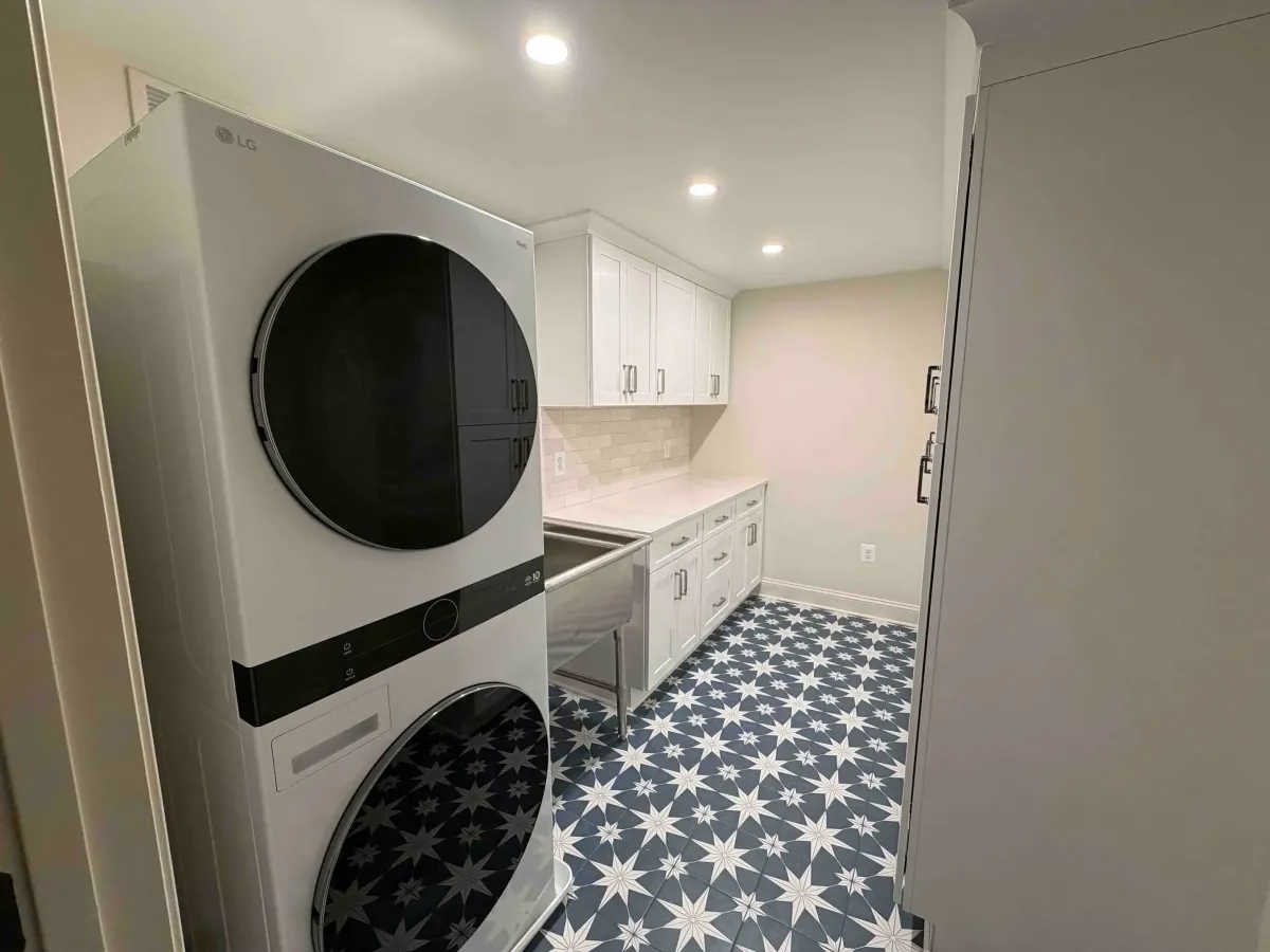 New laundry room with custom cabinetry added to Falls Church basement during full remodel