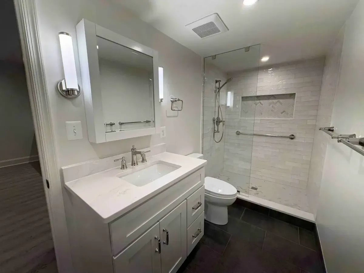 Reconfigured Falls Church basement bathroom with updated layout and new tile work