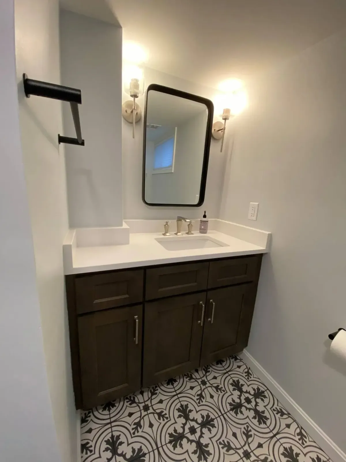 Arlington basement vanity built around structural column to maximize space