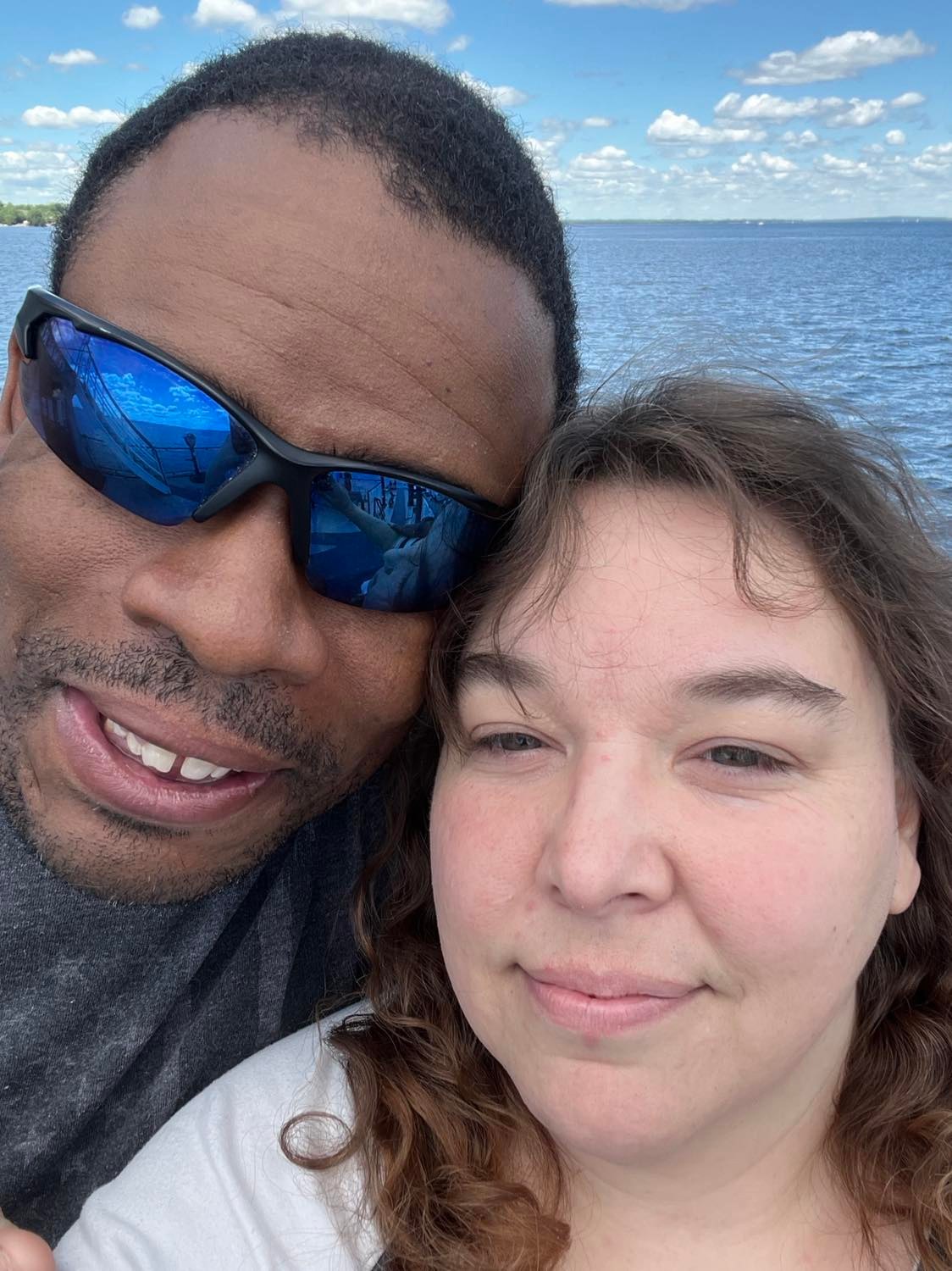 Mandy and her husband Matt smiling together after overcoming hardship.