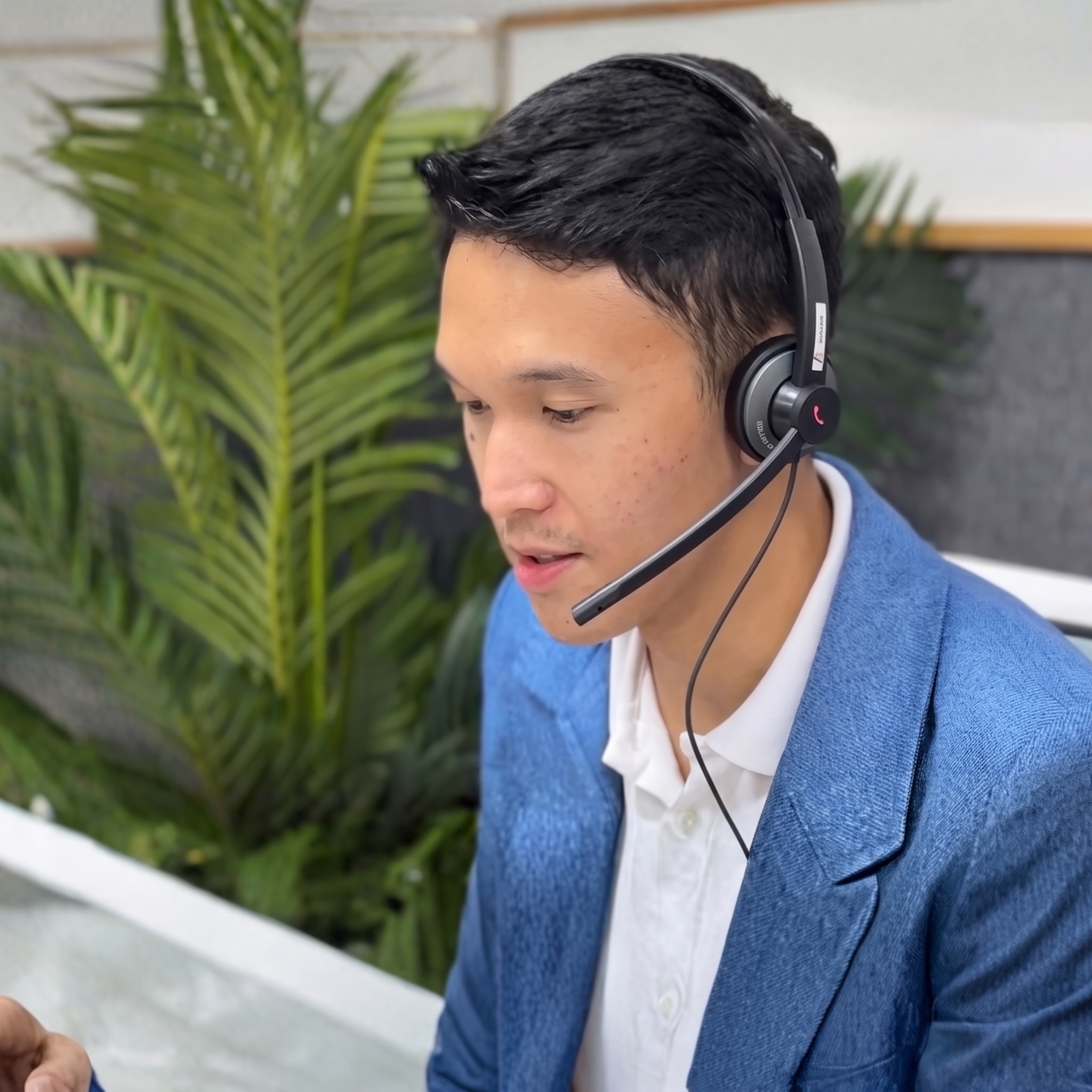 A dedicated Air Secretary medical secretary at work in the Dumaguete office, wearing a headset to support day-to-day admin, scheduling, and patient communication for an Australian specialist practice.