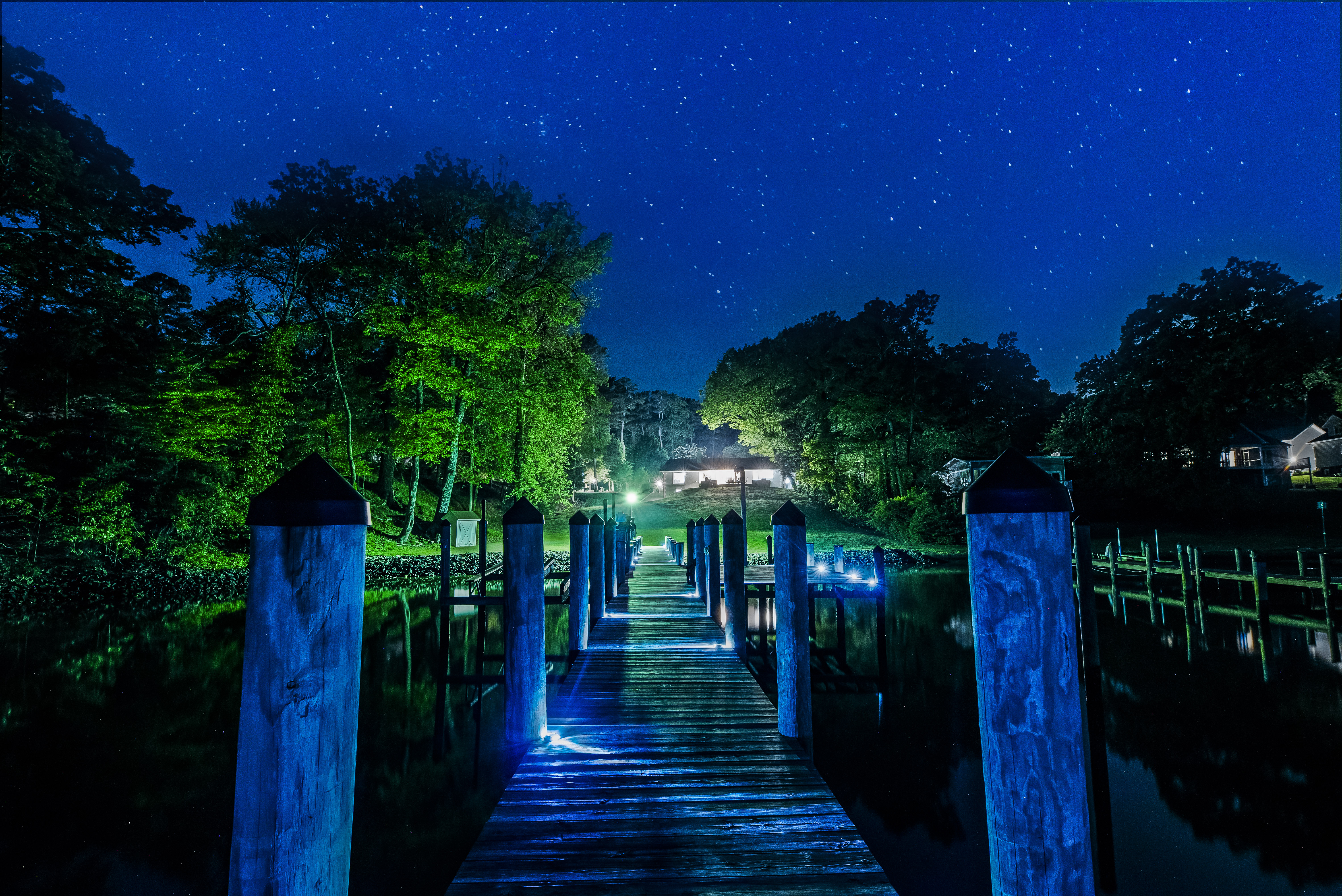 Luxury waterfront dock at night in Southern Maryland with private pier and water access