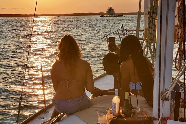 Boating at sunset on the Chesapeake Bay in Southern Maryland waterfront lifestyle
