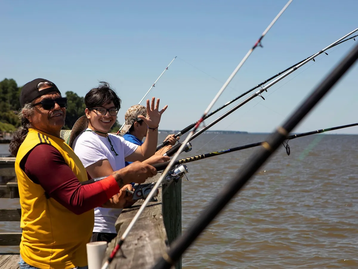 Fishing from a pier in Southern Maryland Chesapeake Bay waterfront lifestyle
