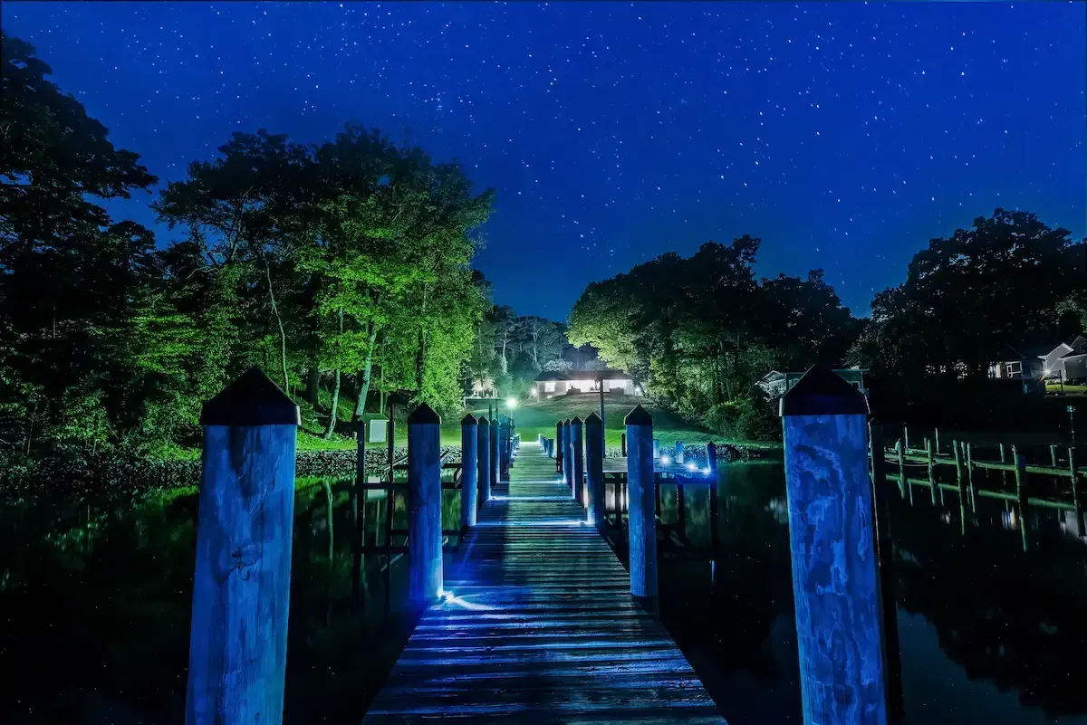 Luxury waterfront dock at night in Southern Maryland with private pier and water access