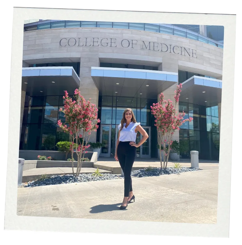 Autumn Raines Lockett, admissions coach, in front of College of Medicine