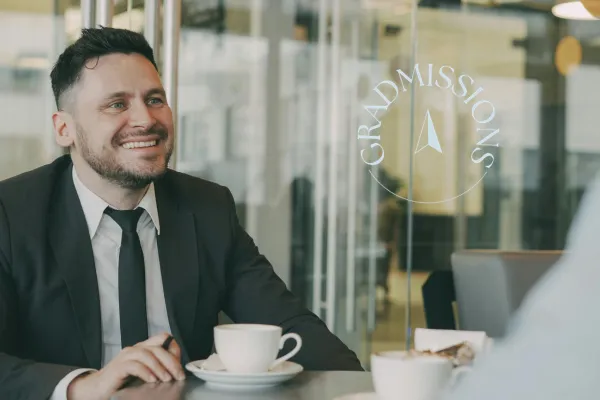 Student Smiling at Networking Coffee