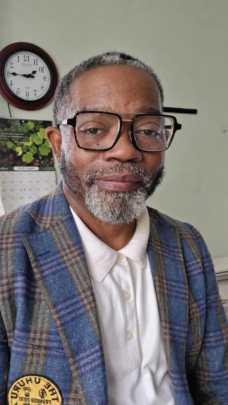 A woman in a scout uniform looks forward attentively