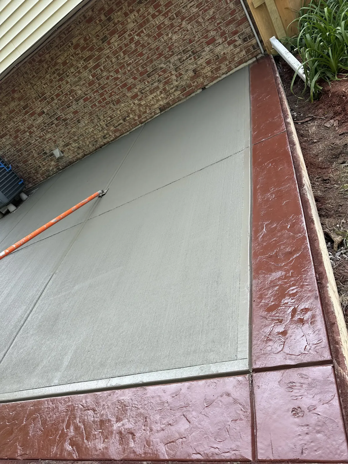 concrete patio installation in Cincinnati Ohio backyard outdoor living space modern design