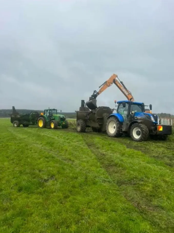 Muck spreader services for farm waste management, ensuring clean and fertile land by Dean Moore Excavation.