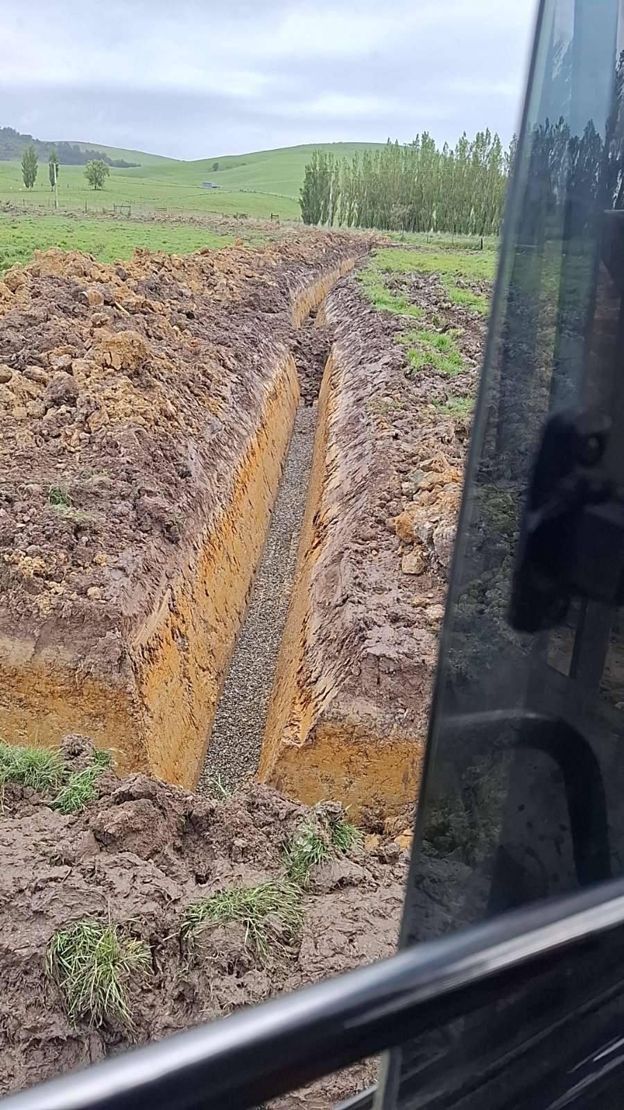 Excavation work by Dean Moore Excavation, showcasing a farm site preparation project in Southland