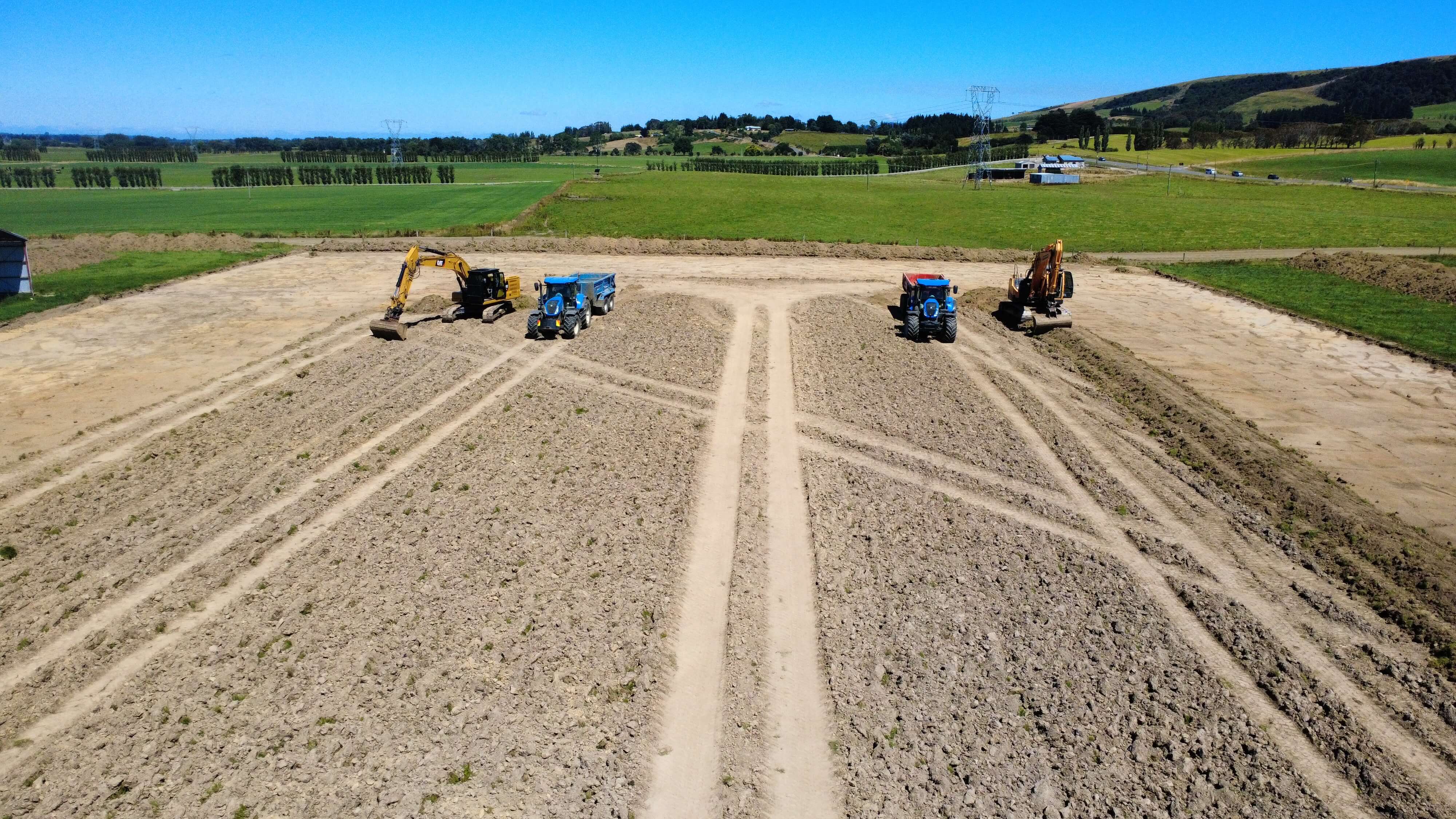 Dean Moore Excavation completing grading and drainage work on a Southland farm.