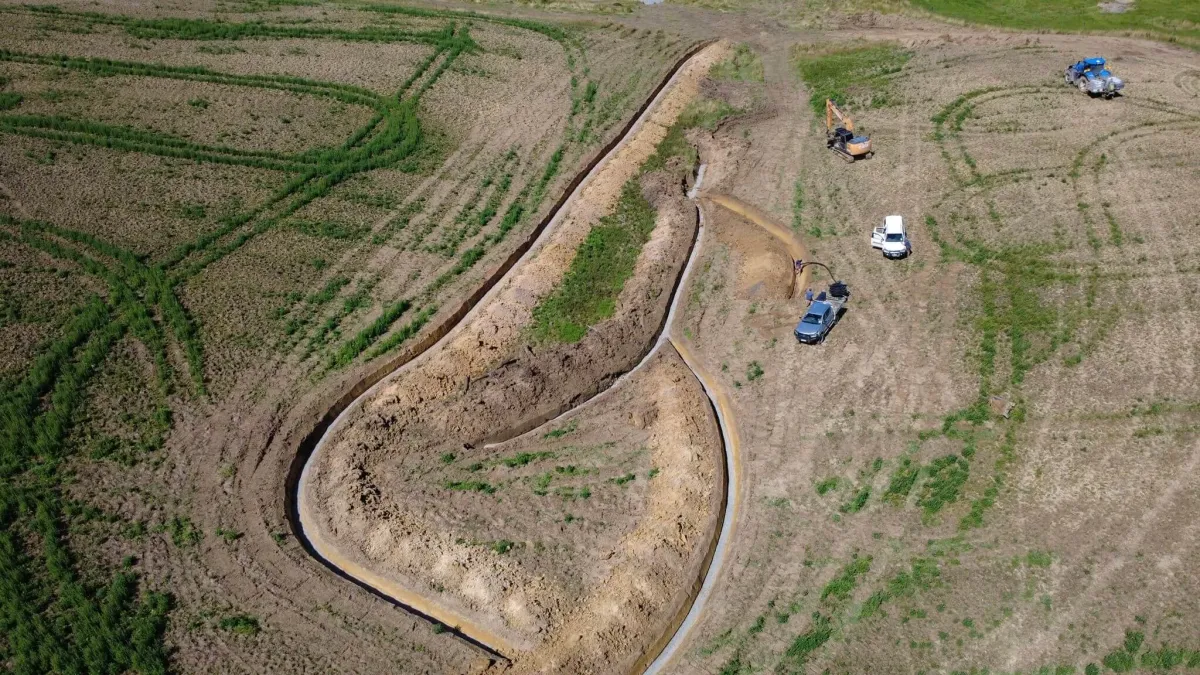 Muck spreading service provided by Dean Moore Excavation, improving farm efficiency in Southland.