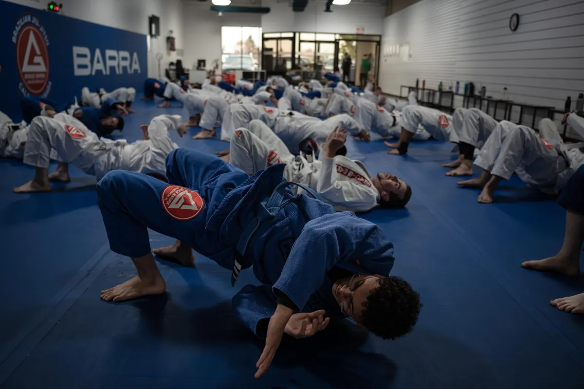 a close up of a person wearing blue gloves